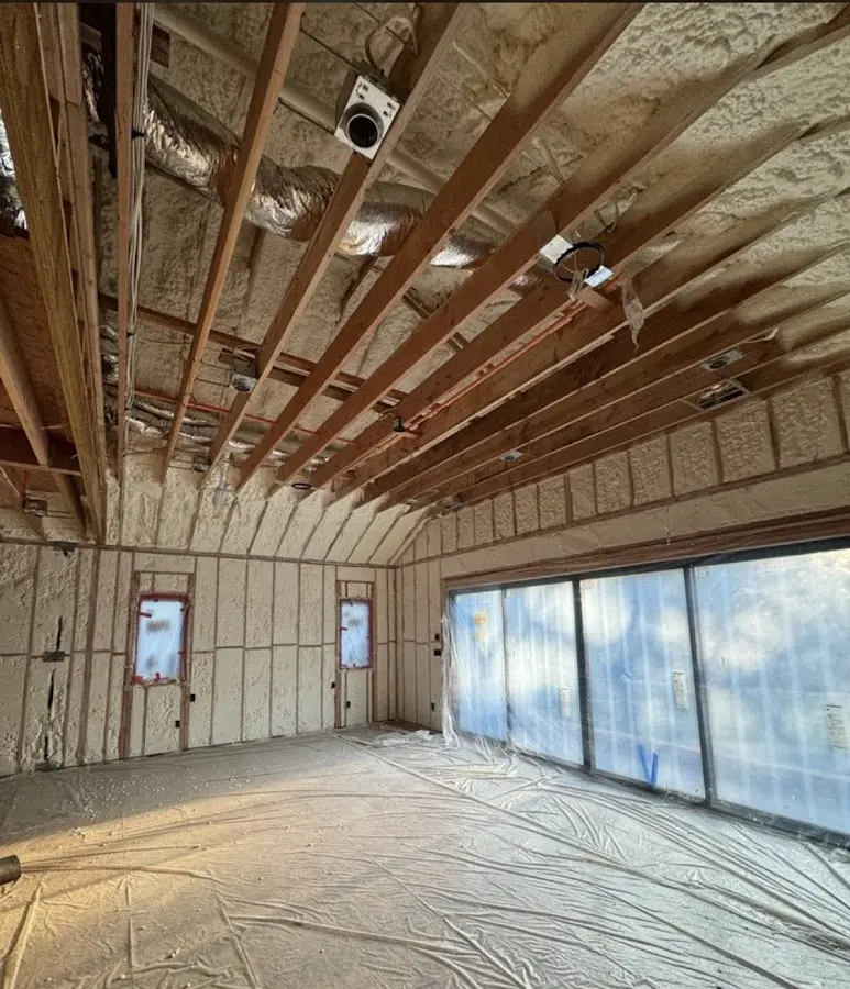 Interior walls and ceiling insulated with spray foam during new construction in Garfield Heights